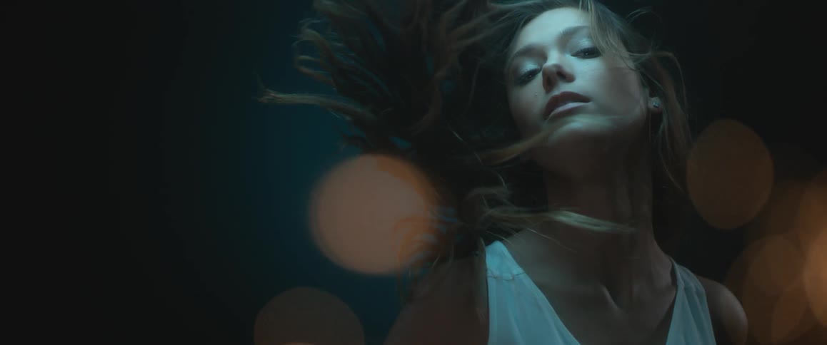 A person's hair blowing in the wind