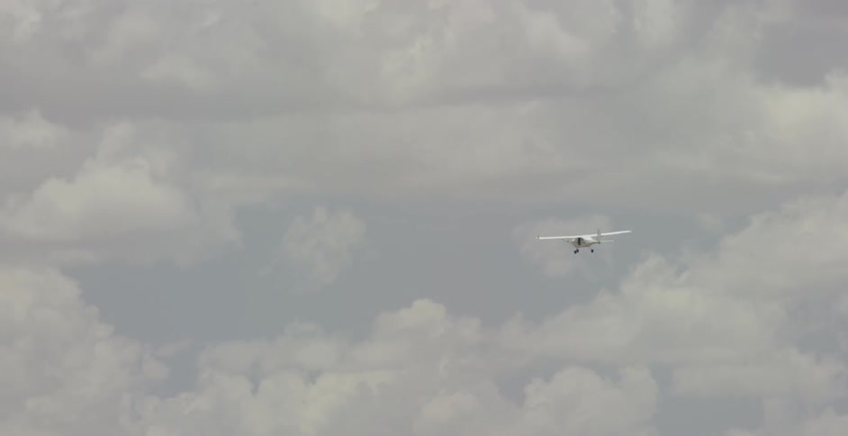 An airplane flying and gliding across the sky