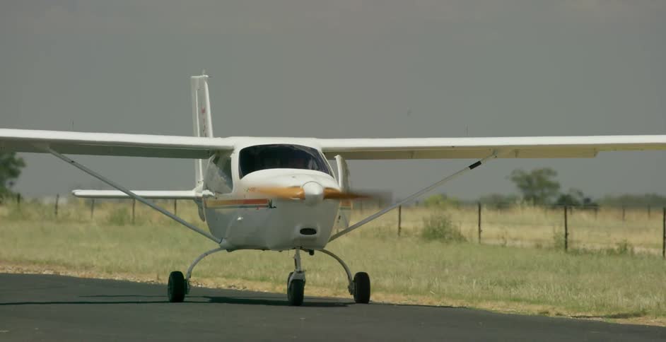 Airplane traveling on runway during the day