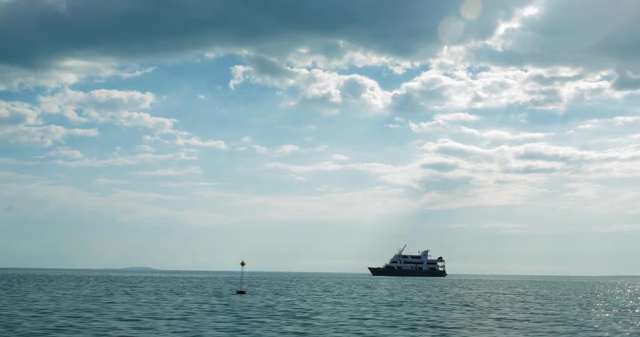 Boat in the middle of the ocean on a sunny day