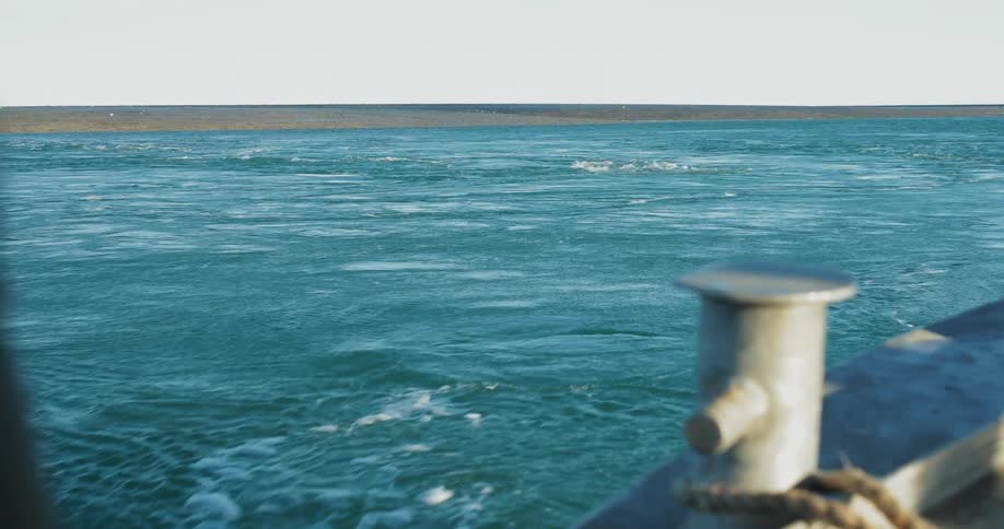 A boat is moving toward shore