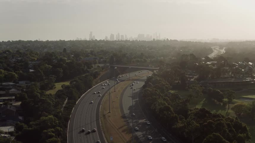 Cars travel over the winding roads