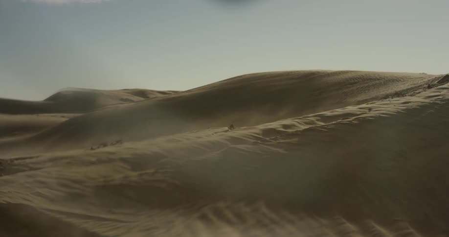 Dust blowing in the desert on a sunny day