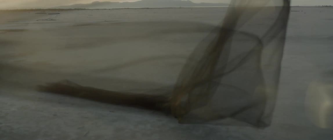 Long veil blows in the wind on a sunny day