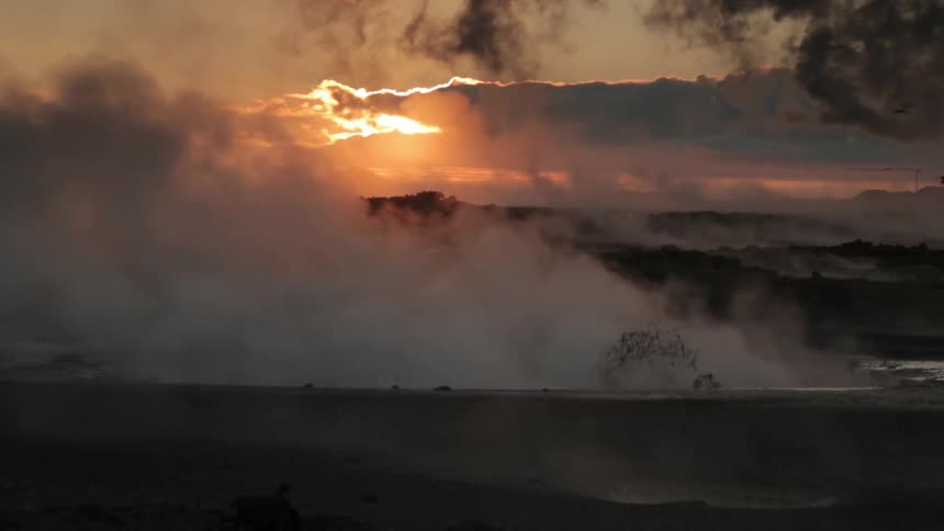 Steam erupts into the air as water bubbles