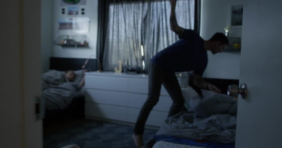 A man films himself waking up two young boys