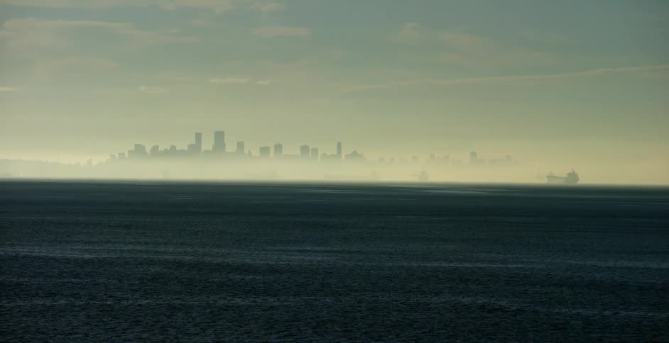 A city skyline over a body of water