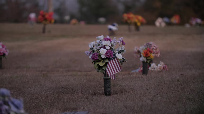 Flowers placed in a field as a memorial