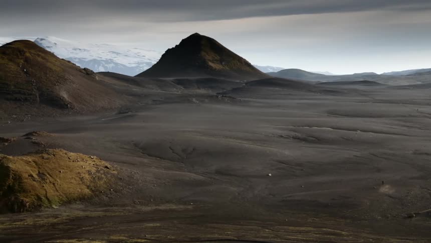 View of a hilly land on a cloudy day
