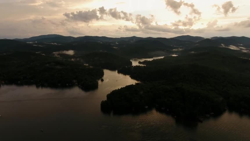 A large body of water broken up by green land