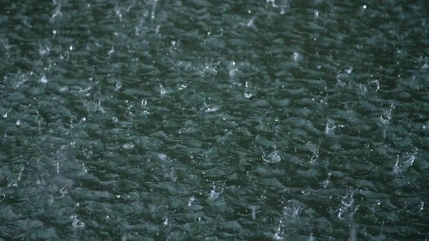 The heavy rain is making splashes in the pool below