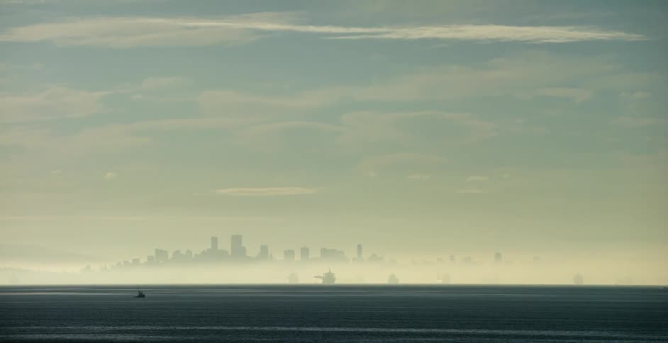 The city ahead is covered with fog