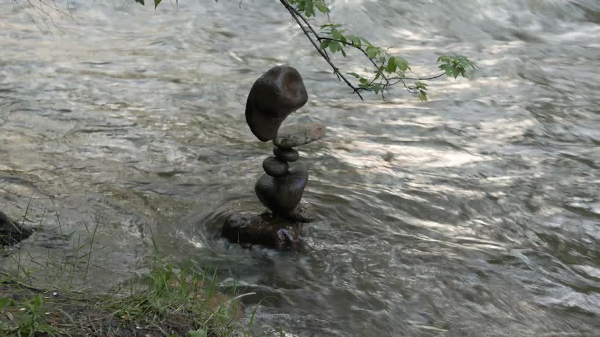 Stones balanced in a pile in a stream