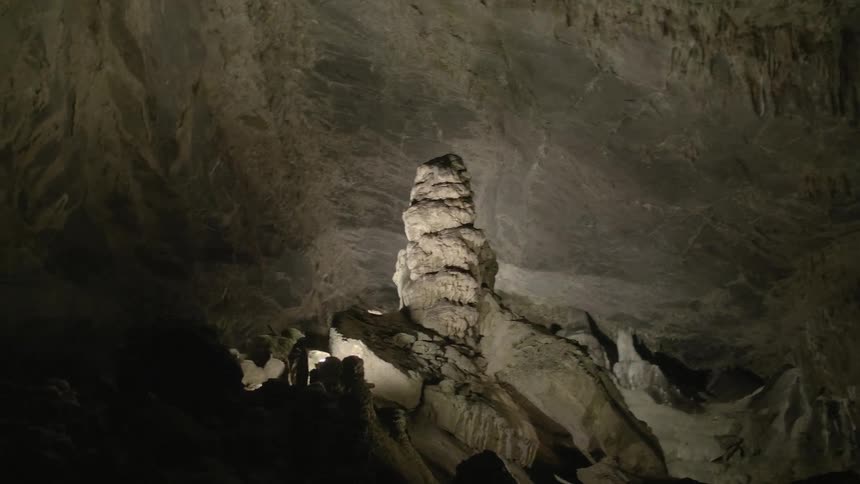 Cave lit up by a small light