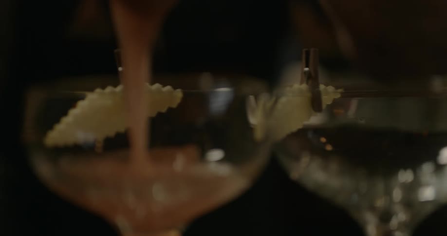 The glasses are being filled with drinks