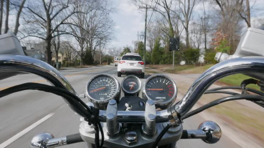 Motorcycle traveling down a busy road