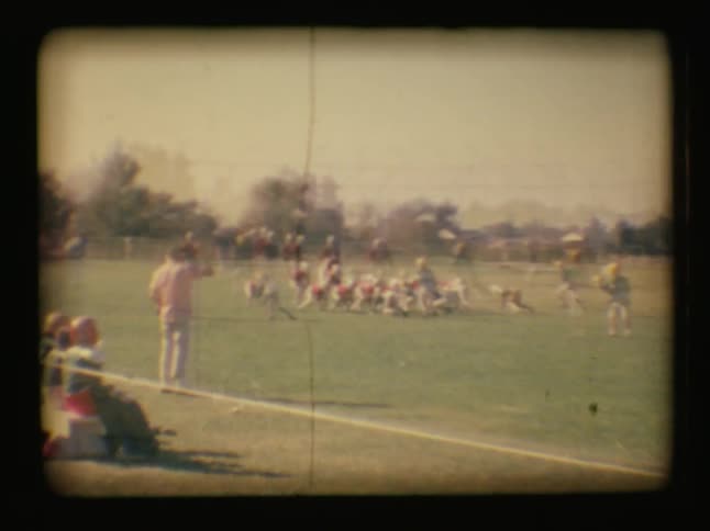 Boys compete at a football game