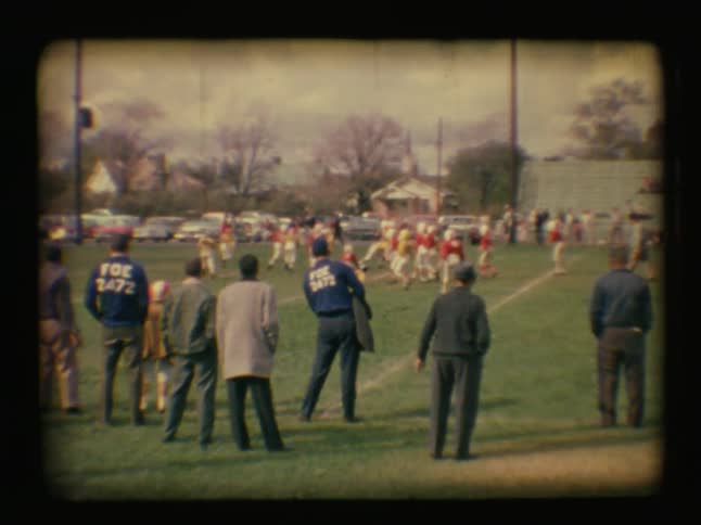 People on the sidelines of a football game
