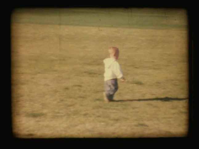 A child is running on the lawn