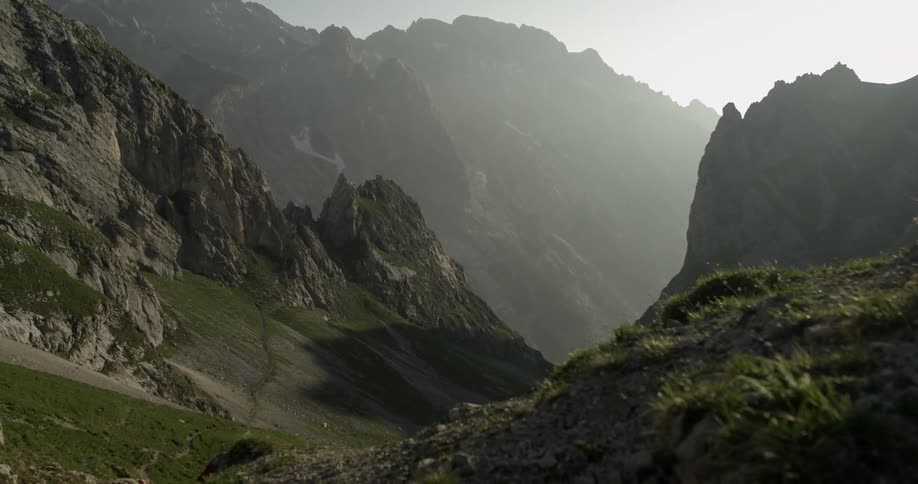 The mountain range is covered with fog