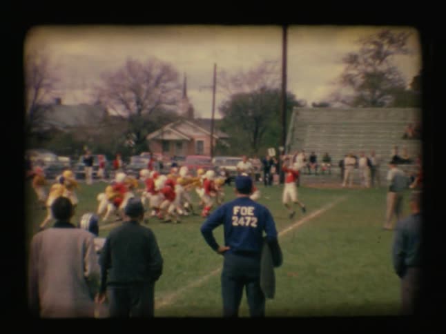 A football game is going on with players running all over
