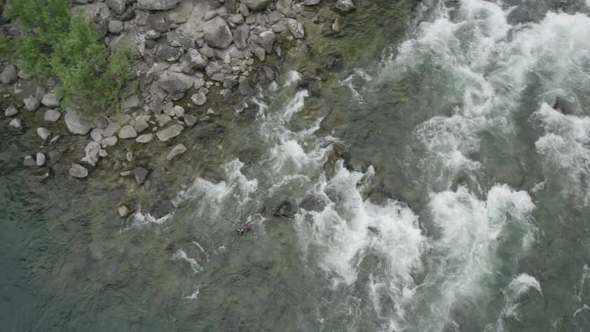 A drone flying over a river