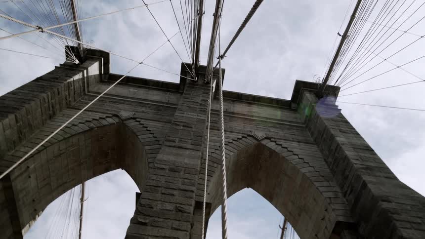 The bridge is tall and made of stone
