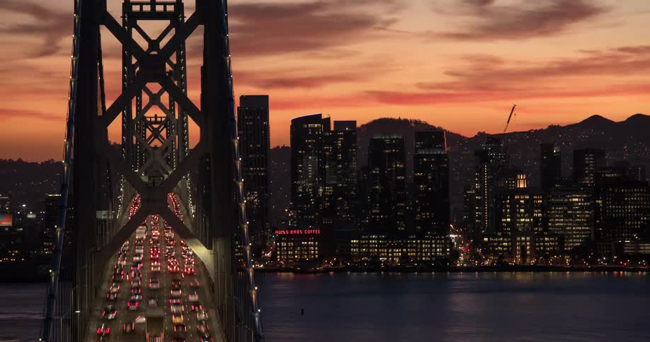 The bridge is full of vehicles traveling towards the city