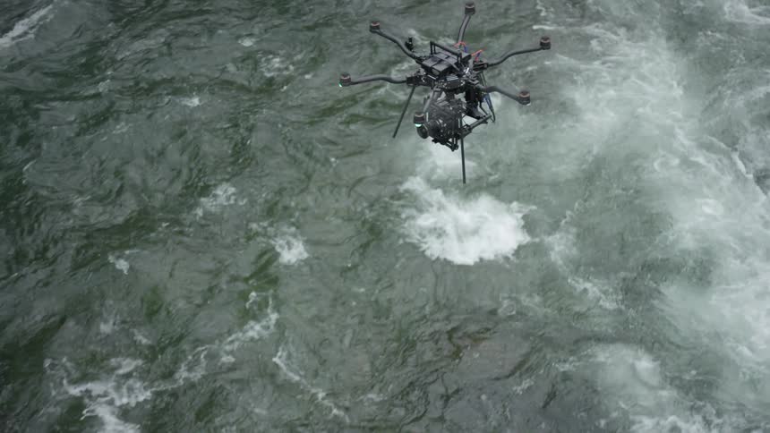 A drone flying over water