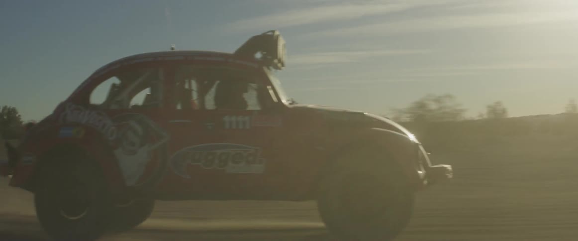 A car races in the desert jumping