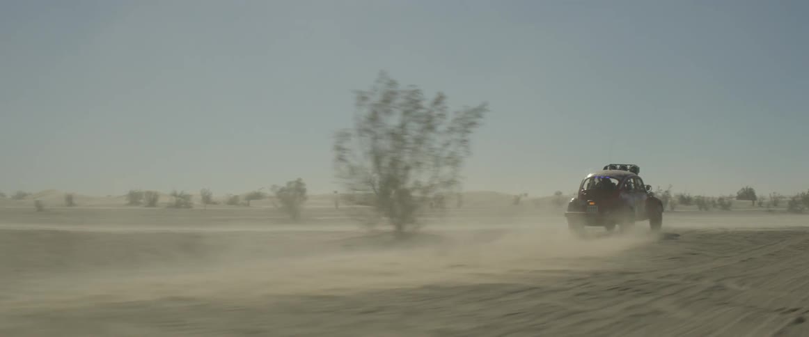 Vehicle travels quickly through the desert