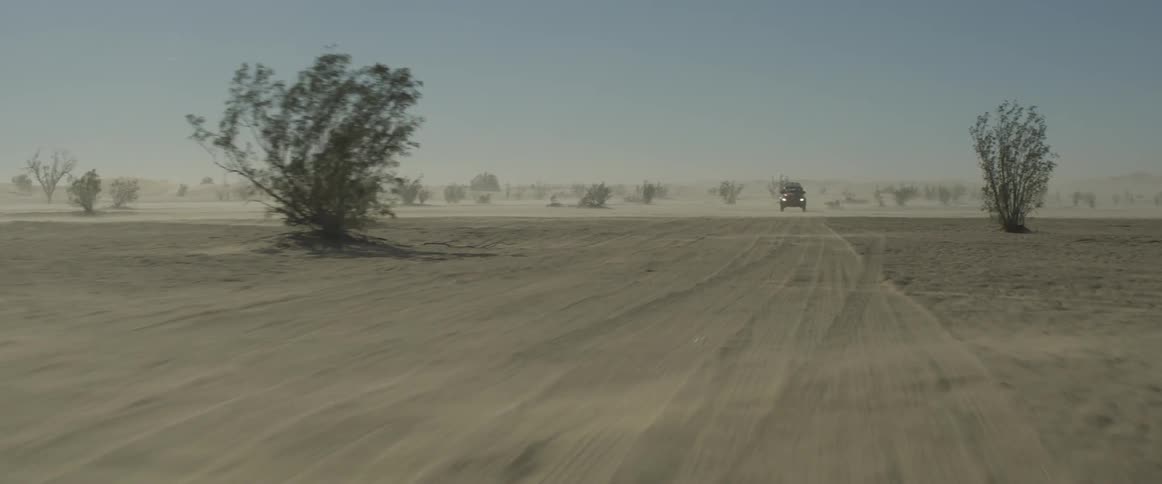 A vw bug races during an off-road desert race