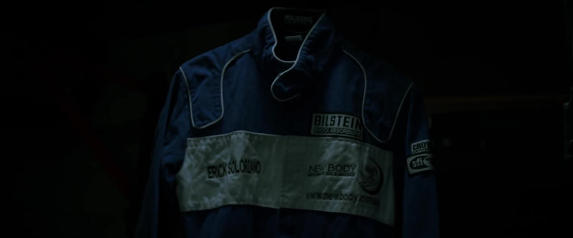 A racing jacket is in the dark room