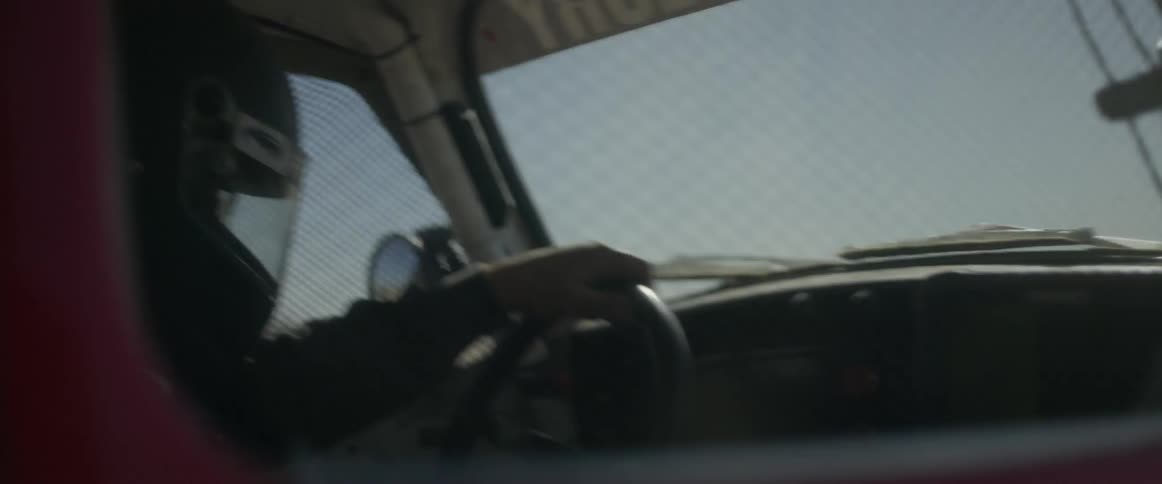 A person is racing a car