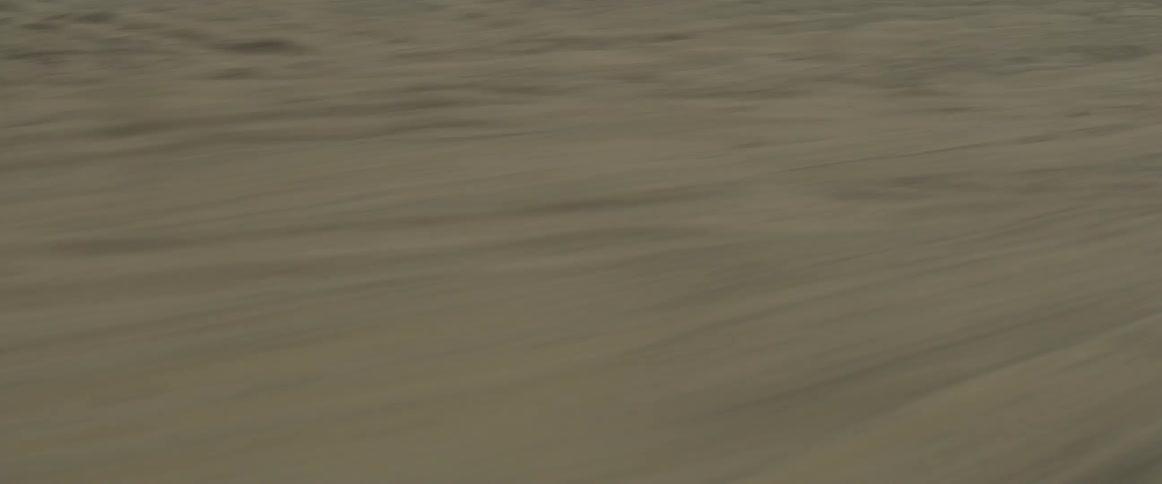 Dirt is kicked up on an off-road race course