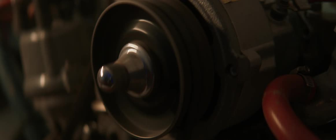 Light shines on a revving car engine