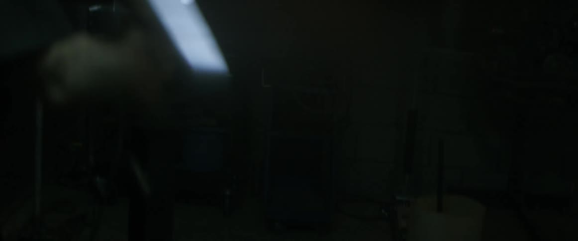 Sparks fly as man uses a saw in the garage