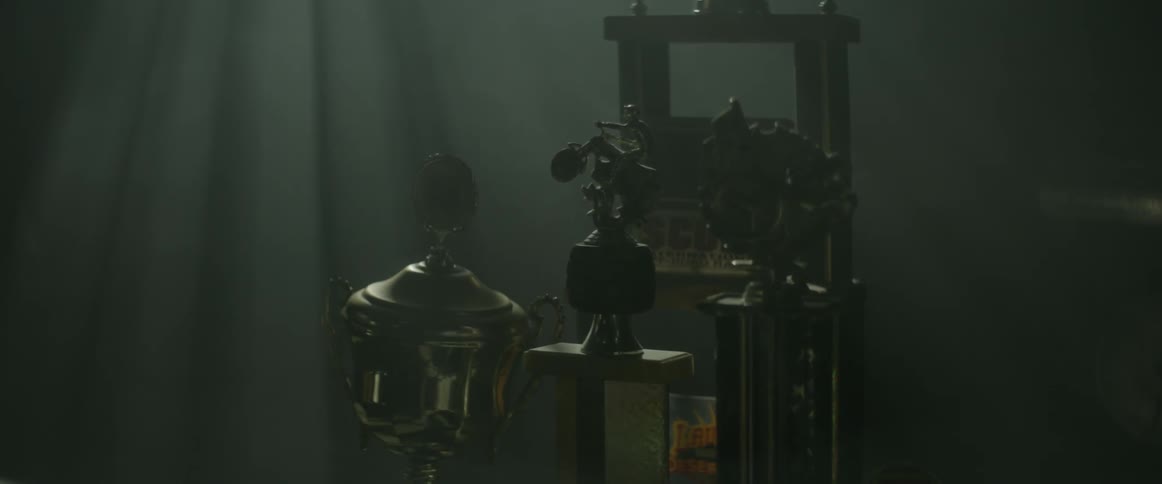 Dust scatters in a room with trophies