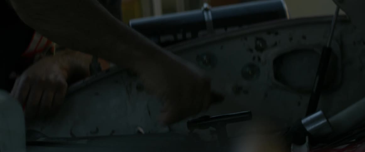 A man is working on an automobile
