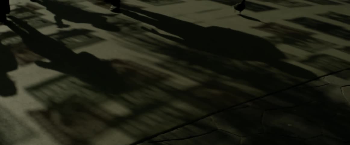 Shadows on the ground of people walking