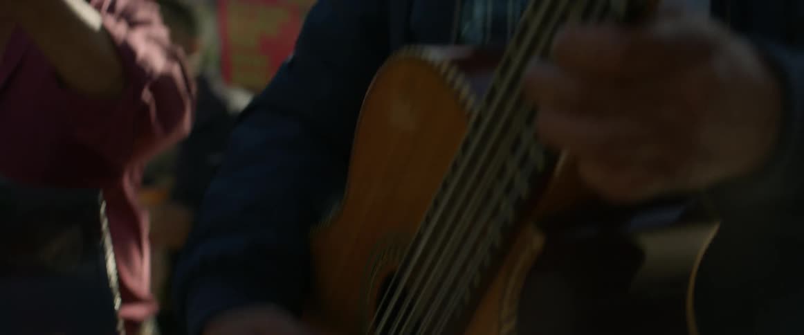 A man plays the guitar