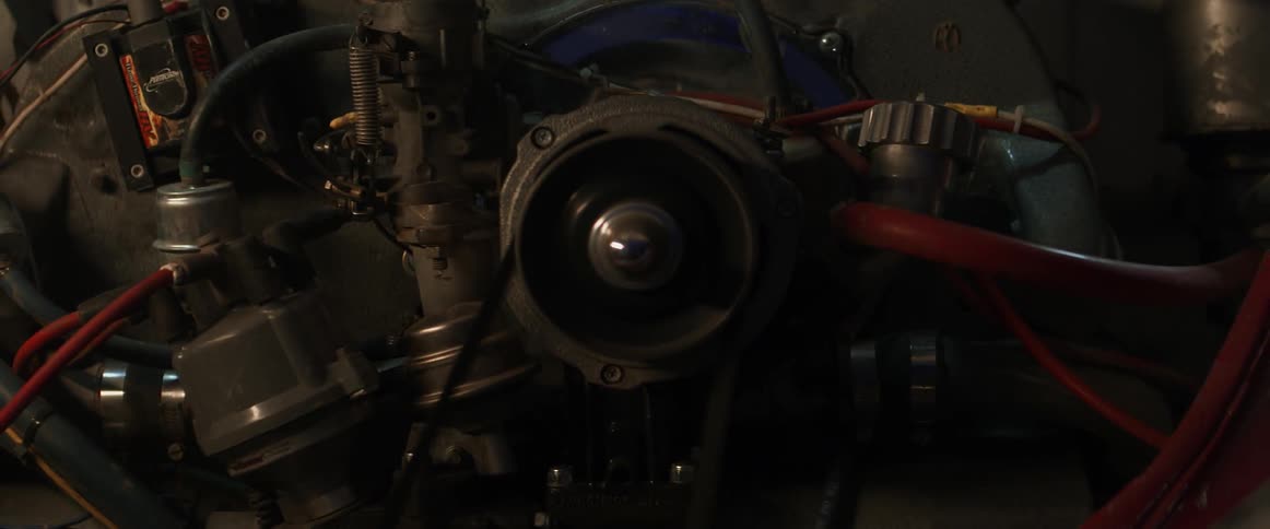 A belt spins attached to an engine