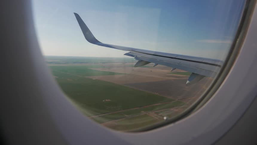 An airplane flies low as it prepares to land