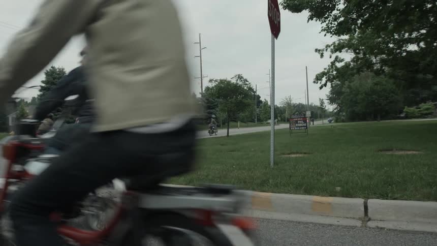 A group of bikers turn a corner