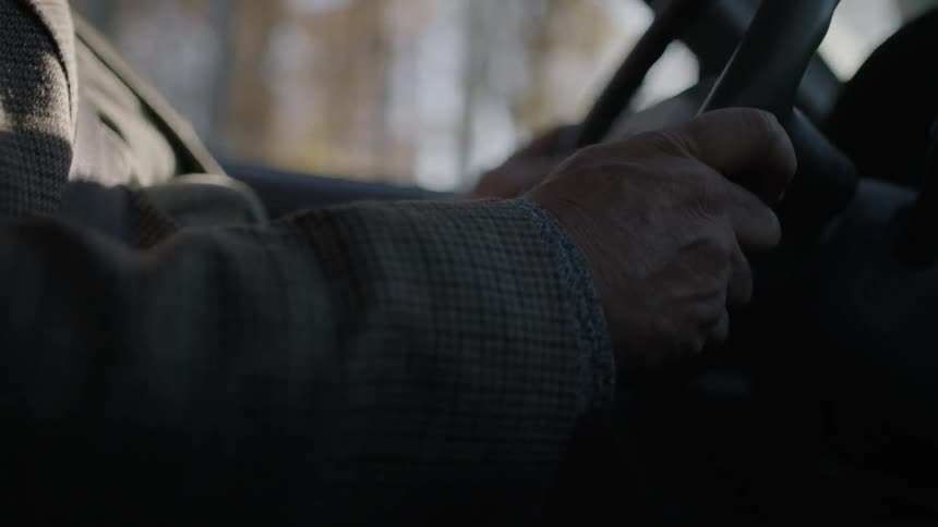 Steering wheel is being held with two hands