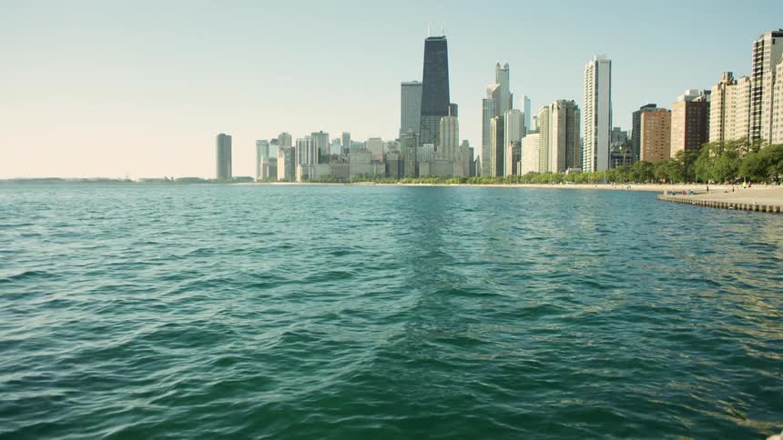Ocean waves come up to the coast line of a city