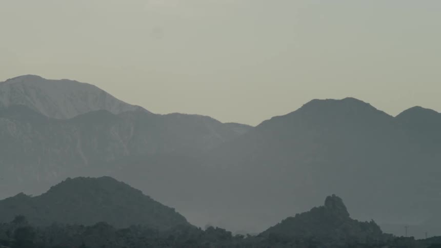 A mountain range is shown on a clear day