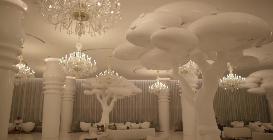 White sculpted trees in a brightly lit room
