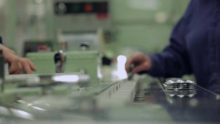 People are working on a production line