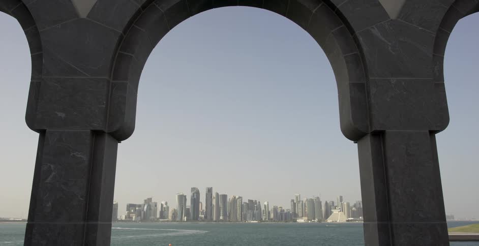 A view of an archway and looking into the city